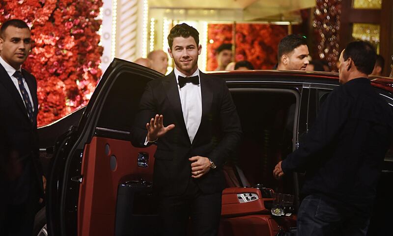 US musician Nick Jonas waves as he arrives. AFP