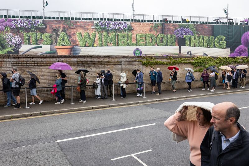 Fans queue to enter Wimbledon on day one of The Championships, the world's oldest tennis tournament, in 2021.