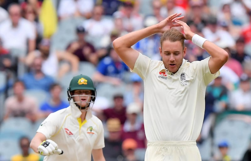 England's Stuart Broad, right, raises his arms after a missed catching chance against Australia during the fifth day of their Ashes cricket test match in Melbourne, Australia, Saturday, Dec. 30, 2017. (AP Photo/Andy Brownbill)