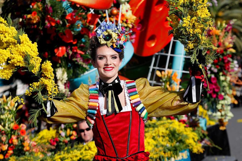 A woman wearing a colourful costume takes part in the Flowers Parade of the 136th annual Carnival of Nice, in Nice, France.  EPA