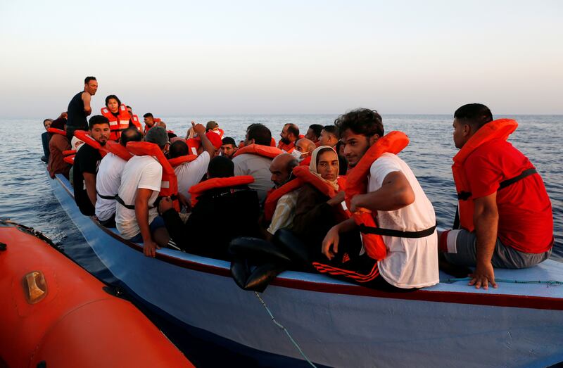 Migrants in a small boat wait to be rescued by ‘Sea-Watch 3’, run by a German NGO, in international waters off the coast of Libya.
