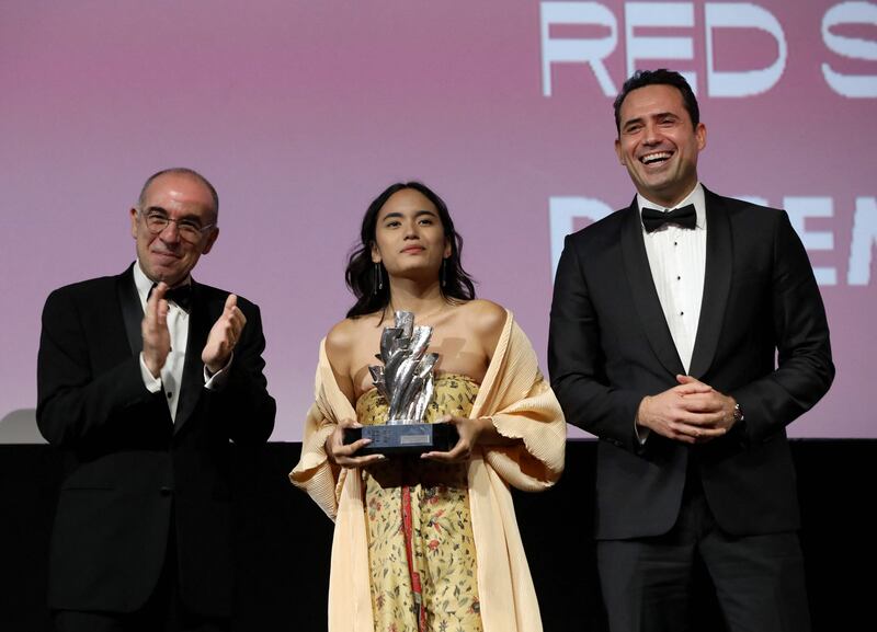 Indonesian actress Ara Winda Kirana receives her Best Actress award for her role in the film 'Yuni'. Photo: Red Sea International Film Festival / AFP