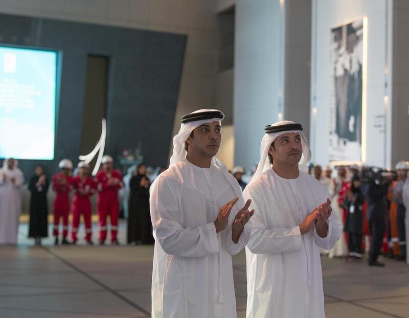 Sheikh Mansour bin Zayed and HH Sheikh Hazza bin Zayed applaud a presentation during the official opening of the Abu Dhabi National Oil Company Headquarters. Mohamed Al Hammadi / Crown Prince Court — Abu Dhabi