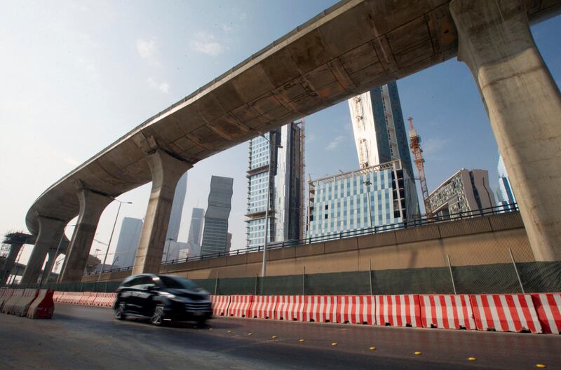 A car drives past a construction site of Riyadh Metro and the King Abdullah Financial District in Riyadh, Saudi Arabia, November 12, 2017. Picture taken November 12, 2017. REUTERS/Faisal Al Nasser