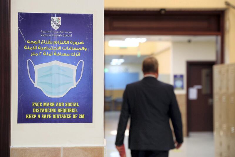 SHARJAH, UNITED ARAB EMIRATES , September 24 – 2020 :- Face mask signs pasted on the walls at the Victoria English School in Sharjah. Schools in Sharjah are opening on 27th September.  (Pawan Singh / The National) For News. Story by Salam