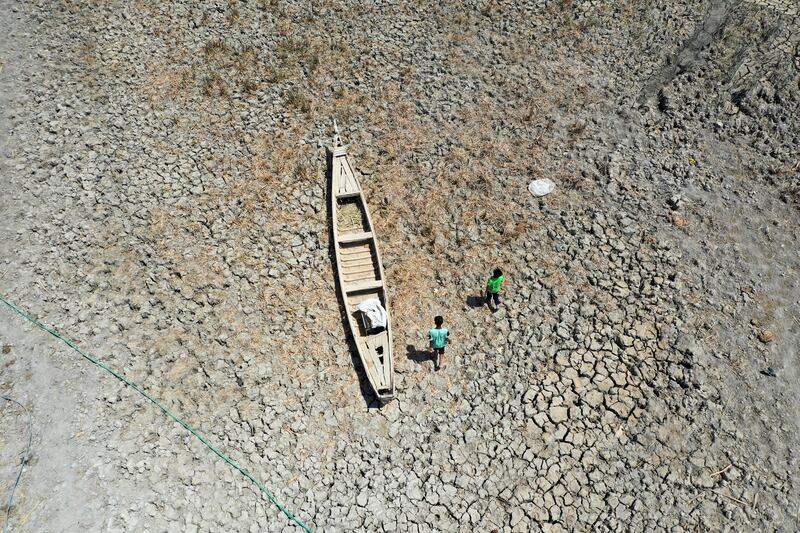 A boat is stranded during low tide at the Chebayesh marsh in Dhi Qar province, Iraq. Reuters