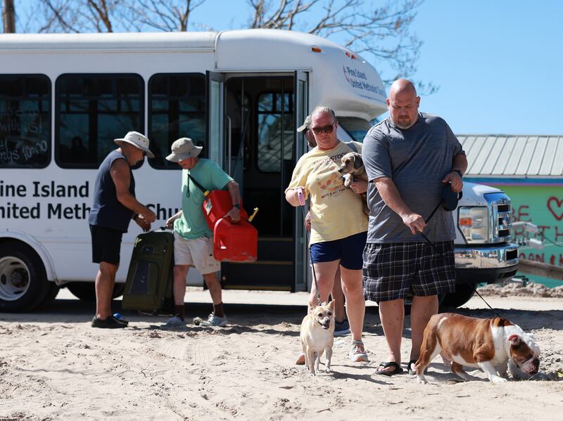 Pine Island residents and their dogs. Getty / AFP