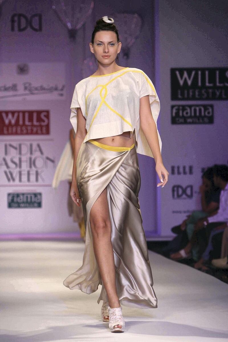 NEW DELHI, INDIA - OCTOBER 06: A model walks the ramp for designer Wendell Rodricks at the Wills Lifestyle India Fashion Week in New Delhi on October 06, 2012. (Photo by Ramesh Sharma/The India Today Group via Getty Images)
