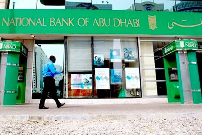 Abu Dhabi, United Arab Emirates, July 31, 2012:    A man walks past the National Bank of Abu Dhabi NBAD branch on Al Salam street in Abu Dhabi on July 31, 2012. Christopher Pike / The National