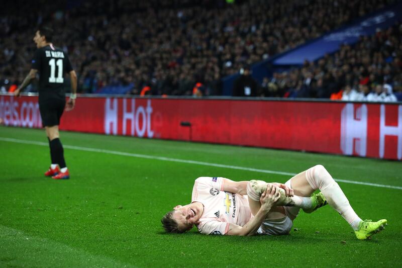 PARIS, FRANCE - MARCH 06:  Scott McTominay of Manchester United reacts to a tackle by Angel Di Maria of PSG warranting him a yellow card during the UEFA Champions League Round of 16 Second Leg match between Paris Saint-Germain and Manchester United at Parc des Princes on March 06, 2019 in Paris, . (Photo by Julian Finney/Getty Images)