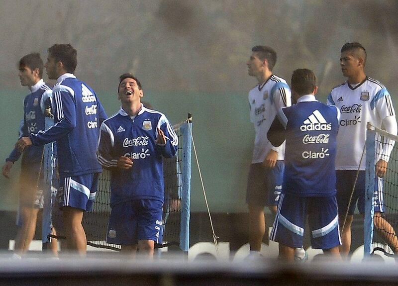 Lionel Messi shown laughing during an Argentina training session on Tuesday in Buenos Aires. Gustavo Amarelle / AFP / May 27, 2014