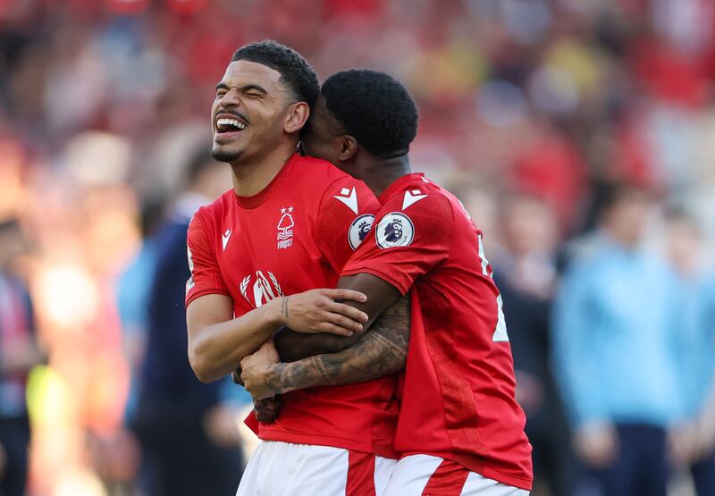 Serge Aurier and Morgan Gibbs-White of Nottingham Forest celebrate after the team's victory. Forest's 1-0 win over Arsenal secured their Premier League status. Getty Images