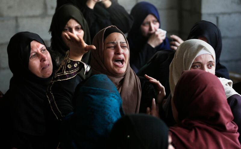 Palestinian relatives of Islamic Jihad militant Abdullah al-Belbasi mourn during his funeral in Beit Hanun in the northern Gaza Strip. AFP