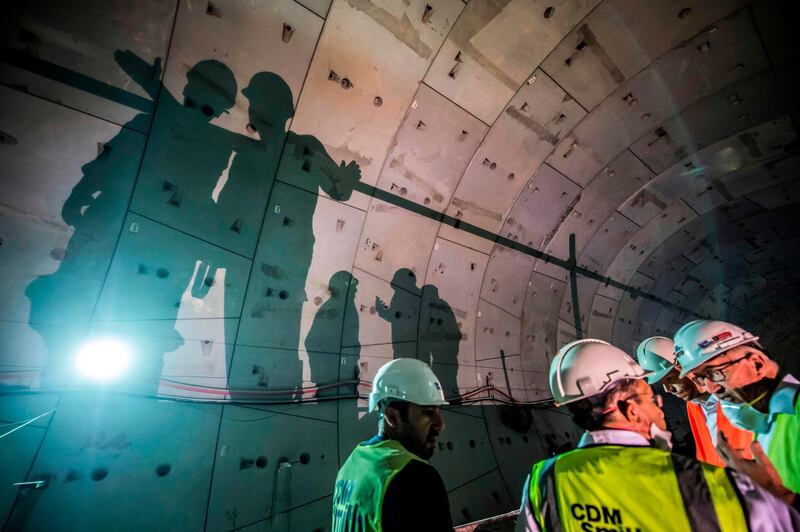 Site engineers discuss construction progress at the Suez road tunnel. AFP