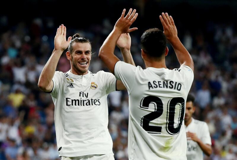 Soccer Football - La Liga Santander - Real Madrid vs Getafe - Santiago Bernabeu, Madrid, Spain - August 19, 2018   Real Madrid's Gareth Bale celebrates scoring their second goal with Marco Asensio    REUTERS/Sergio Perez      TPX IMAGES OF THE DAY