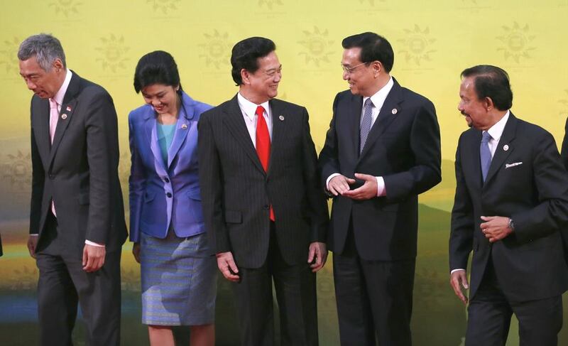 Leaders from Singapore, Thailand, Vietnam, China and Brunei during a family photo session for the 16th Asean-China Summit as part of the 23rd Asean summit in Brunei. Rungroj Yongrit / EPA

