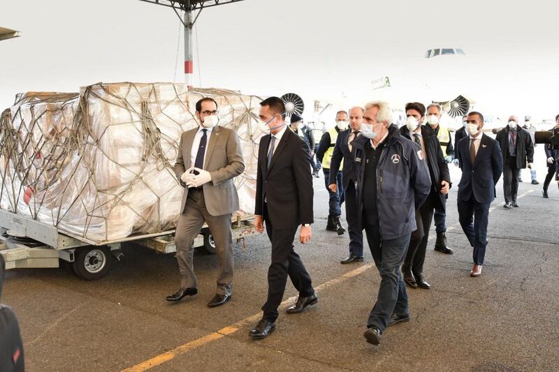 Omar Obaid Al Shamsi, UAE's ambassador in Rome, pictured centre in a black suit, is shown the medical equipment shipment before it is sent on to hospitals. Protective equipment is crucial to ensuring frontline medical workers do not become casualties. Courtesy: Ministry of Foreign Affairs and International Cooperation