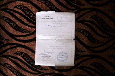 A death certificate issued by ISIL declaring the death of Younis Mohammed's daughter. Mr Mohammed believes his daughter, Naima could have been transferred to Baghdad by members of the Iraqi forces following the liberation of Mosul. Florian Neuhof / The National