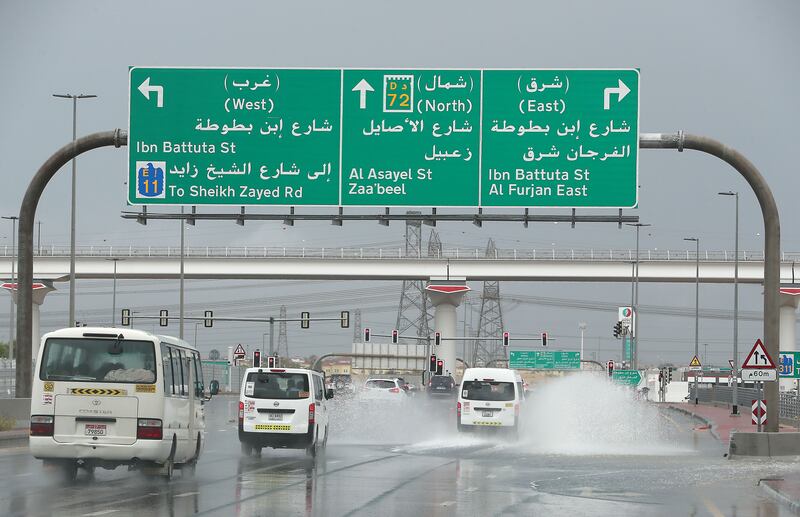 Vehicles drive through wet roads around the Discovery Gardens and Al Furjan area in Dubai. Pawan Singh / The National 