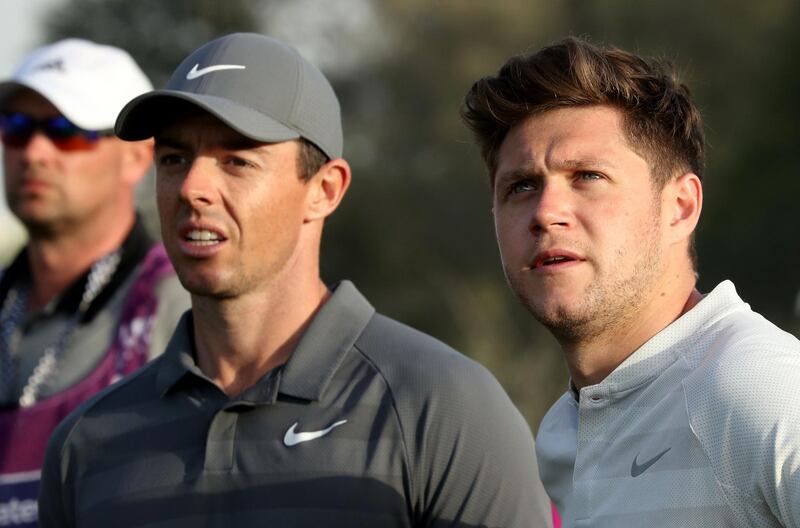 Niall Horan and Rory McIlroy during the pro-am at Emirates Golf Club. David Cannon / Getty Images