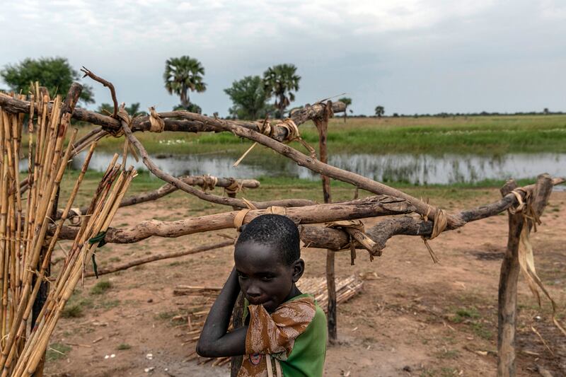 A child in Panthoy village, near Malualkon in Northern Bahr El Ghazal. This state is usually spared extreme flooding, but now, houses and crops have been swamped.