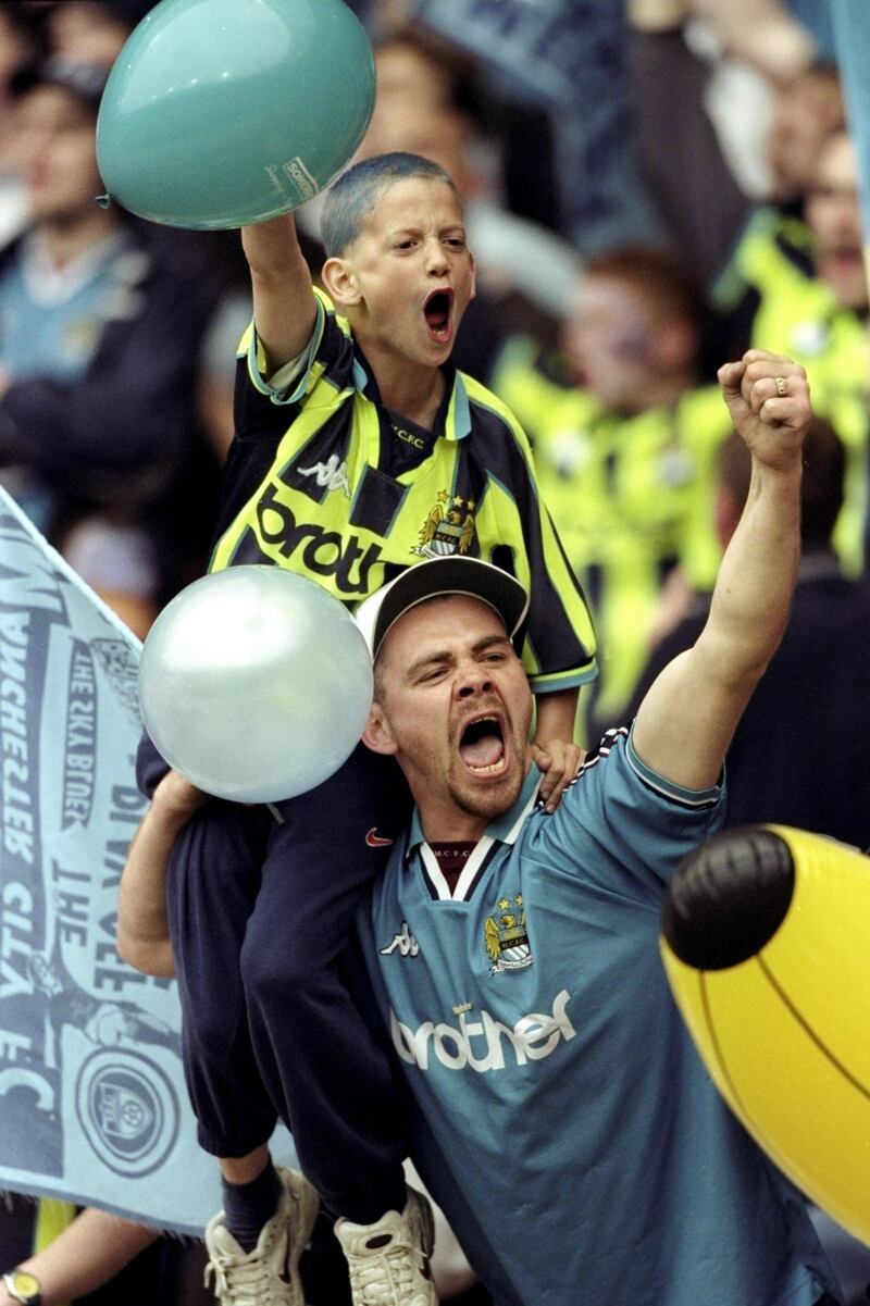 30 May 1999:   Manchester City fans celebrate victory and promotion during the Nationwide Division Two Play-Off Final match against Gillingham played at Wembley Stadium in London, England.  The match finished in a 2-2 draw after extra-time and in the penalty shoot-out Manchester City won 3-1 and were promoted to Division One. \ Mandatory Credit: Alex Livesey /Allsport