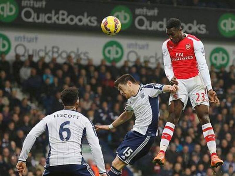 Arsenal's Danny Welbeck, right, scores a goal during their English Premier League soccer match against West Bromwich Albion at The Hawthorns in West Bromwich, central England November 29, 2014.