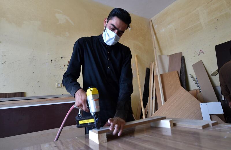 Mohammed Waqas, a Pakistani model and carpenter, works in the Janadriyah district of the Saudi Arabian capital Riyadh. AFP