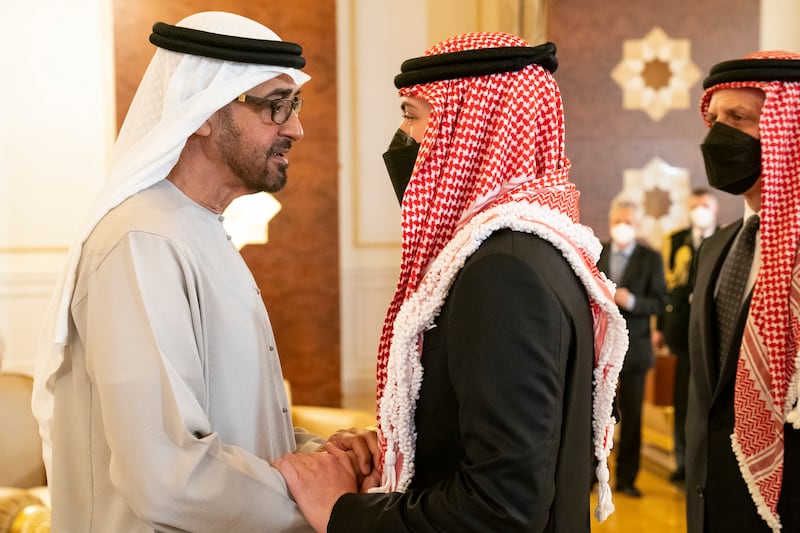 Crown Prince Hussein, right, offers condolences to President Sheikh Mohamed bin Zayed on the death of Sheikh Khalifa, at the Presidential Airport. Photo: UAE Presidential Court