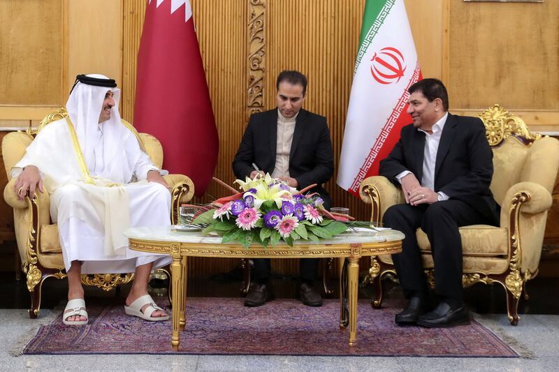 Iran's First Vice President Mohammad Mokhber welcomes Sheikh Tamim after his arrival. Reuters