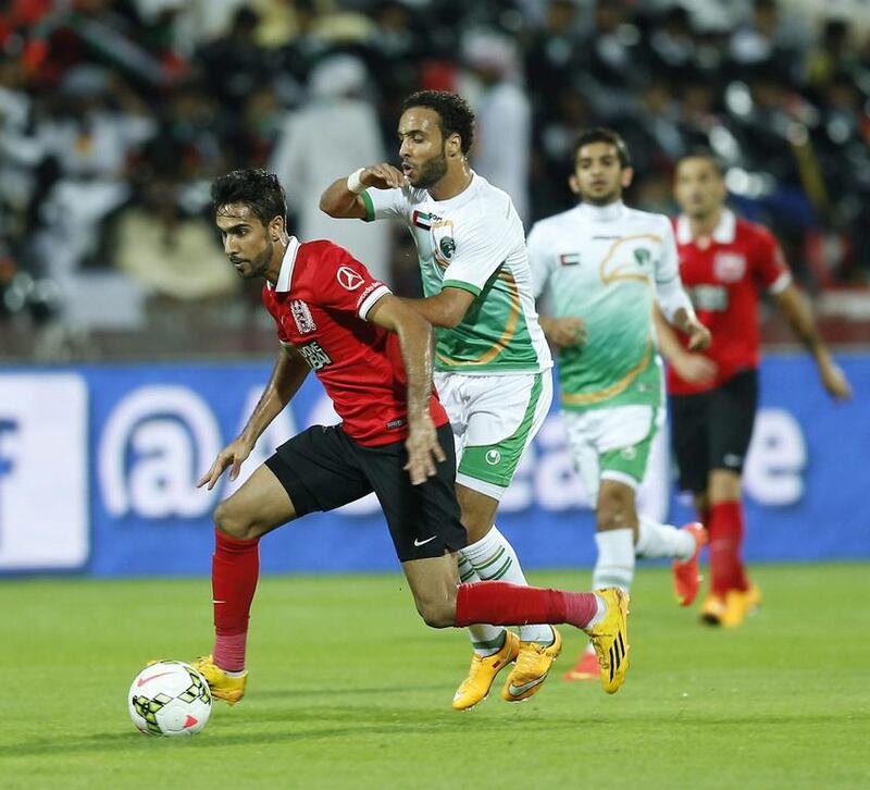 Al Ahli, in red, pictured during their Arabian Gulf League match against Emirates at Rashid Stadium in Dubai on November 30, 2014, have struggled to match the high standards they reached in winning the league title last season. Afsal Sham / Al Ittihad