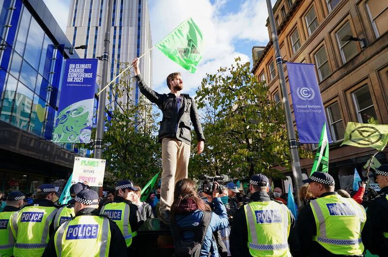 Police and demonstrators at a Extinction Rebellion protest on Buchanan Street, during the Cop26 summit in Glasgow. PA