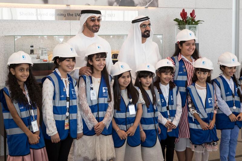 Mohammed bin Rashid and Mohamed bin Zayed pose for a photo with school pupils. Photo: @MohamedBinZayed
