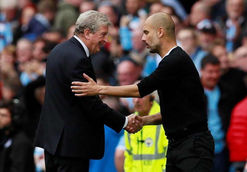 Crystal Palace manager Roy Hodgson shakes hands with Manchester City manager Pep Guardiola after the game. Jason Cairnduff / Reuters