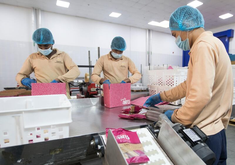 Dubai, United Arab Emirates - Workers at packaging area at Al Barakah Dates Factory, Dubai Industrial City.  Leslie Pableo for The National