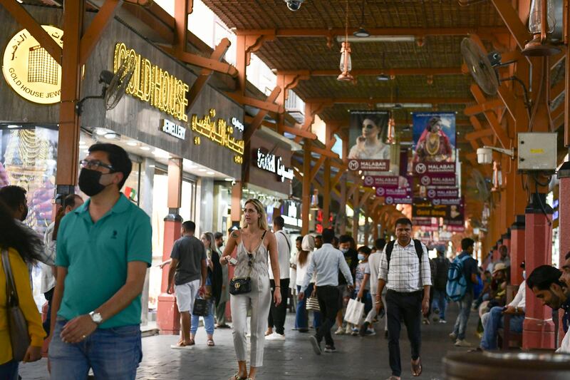 Crowds brave the summer heat at the Deira souq. 