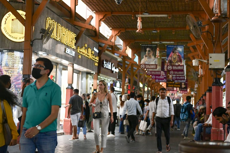 Crowds brave the summer heat at the Deira souq. 
