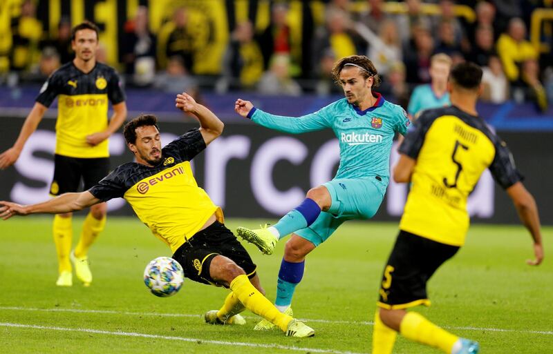 Barcelona's Antoine Griezmann in action with Borussia Dortmund's Mats Hummels. Reuters