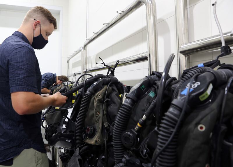 Royal Navy ship divers try out the new Deep Dive Dubai pool.