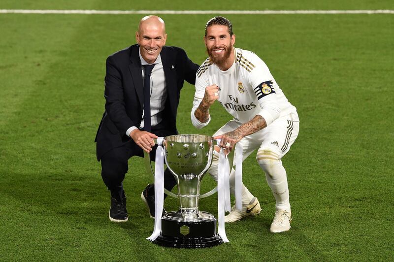 MADRID, SPAIN - JULY 16: Real Madrid head coach Zinedine Zidane and captain Sergio Ramos pose with the La Liga trophy after Madrid secure the La Liga title during the Liga match between Real Madrid CF and Villarreal CF at Estadio Alfredo Di Stefano on July 16, 2020 in Madrid, Spain. (Photo by Denis Doyle/Getty Images)