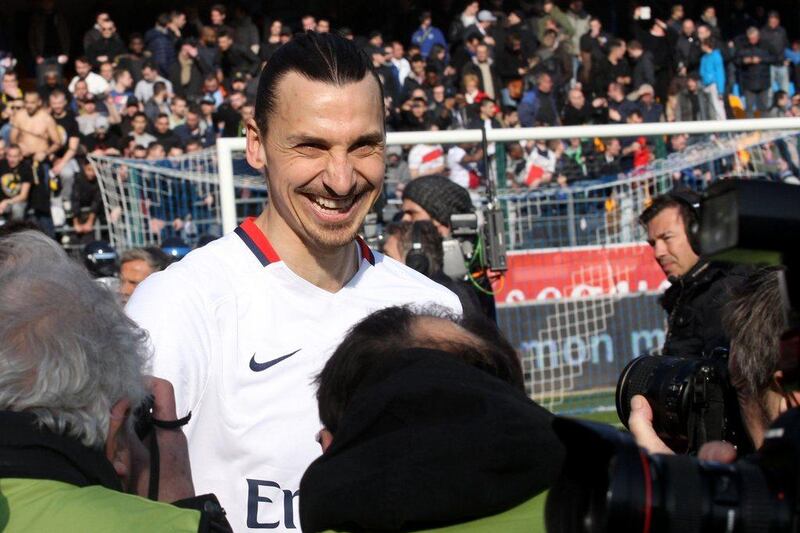 Paris Saint-Germain's Swedish forward Zlatan Ibrahimovic reacts after PSG defeated Troyes in their French Ligue 1 football match on March 13, 2016 at the Aube Stadium in Troyes. Paris Saint-Germain clinched a fourth consecutive Ligue 1 title in record time on March 13 after defeating Troyes, obliterating a new French record for the quickest league victory with eight games to spare before the end of the L1 championships. PHOTO AFP / FRANCOIS NASCIMBENI