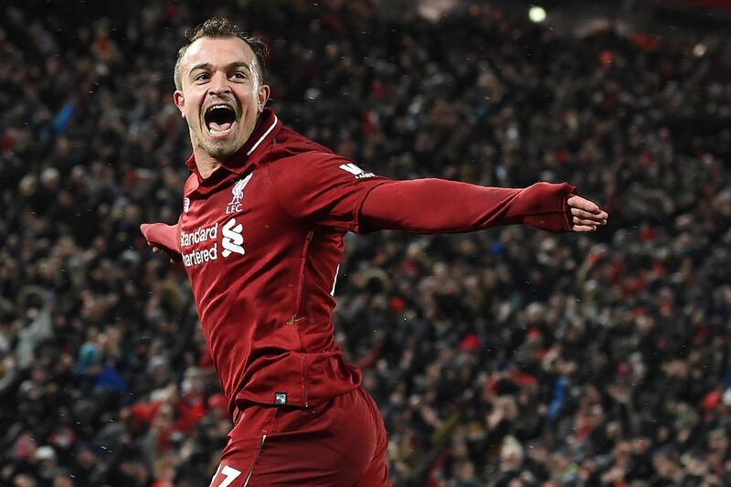 Liverpool's Swiss midfielder Xherdan Shaqiri celebrates after scoring their third goal during the English Premier League football match between Liverpool and Manchester United at Anfield in Liverpool, north west England on December 16, 2018. (Photo by Paul ELLIS / AFP) / RESTRICTED TO EDITORIAL USE. No use with unauthorized audio, video, data, fixture lists, club/league logos or 'live' services. Online in-match use limited to 120 images. An additional 40 images may be used in extra time. No video emulation. Social media in-match use limited to 120 images. An additional 40 images may be used in extra time. No use in betting publications, games or single club/league/player publications. / 