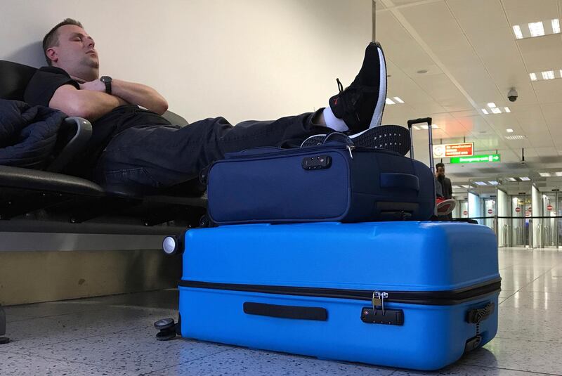 A passenger waits at Gatwick Airport. AP Photo