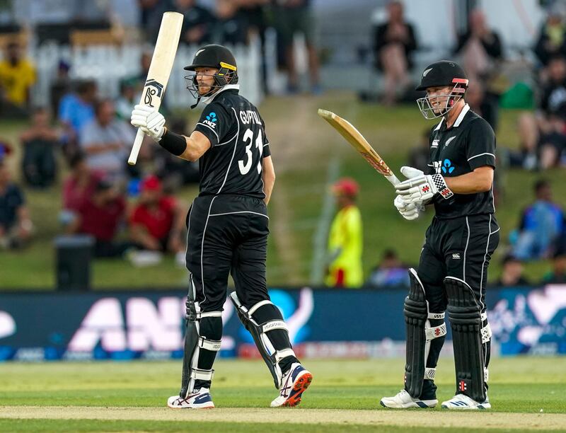 Martin Guptill celebrates his half-century. AP