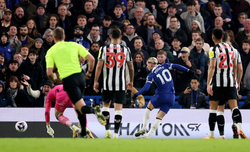 Mykhailo Mudryk rounds Newcastle goalkeeper Martin Dubravka to score Chelsea's third goal. Reuters