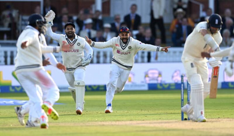 India's Rishabh Pant and Virat Kohli celebrate the final wicket of England seamer James Anderson that sealed victory in the second Test at Lord's on Monday, August 16, 2021.