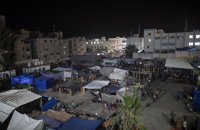 Internally displaced Palestinians spend the night on the grounds of a United Nations school in Khan Younis, southern Gaza, 22 October 2023.  EPA