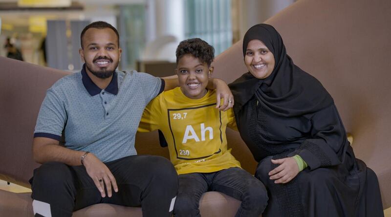 Montasir Elfatih Mohyeldin Taha, (C), with Khalifa, his brother, and his mother.