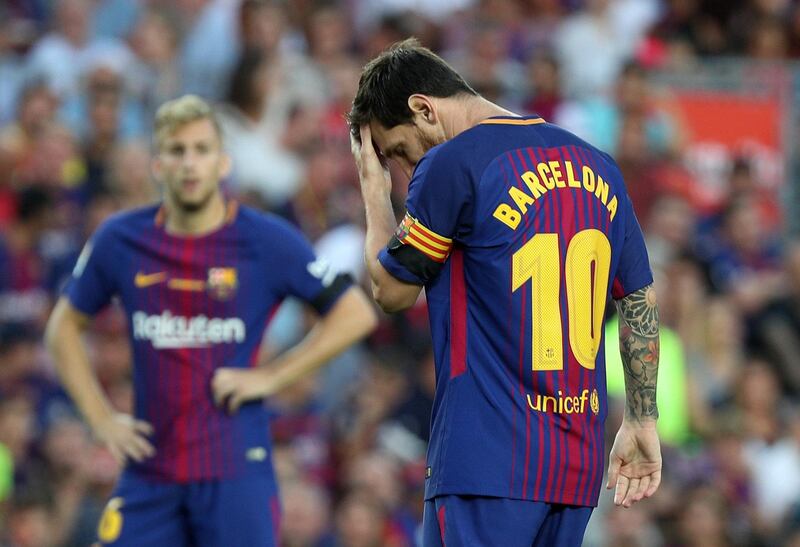 Soccer Football - La Liga - Barcelona vs Real Betis - Barcelona, Spain - August 20, 2017   Barcelona’s Lionel Messi with Barcelona replacing his name on the back of his shirt   REUTERS/Sergio Perez