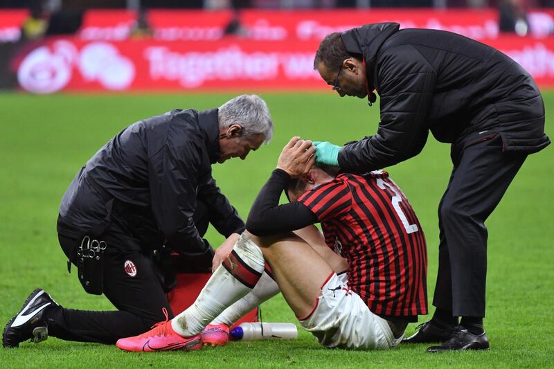 Zlatan Ibrahimovic receives treatment after taking a blow to the head. AFP